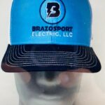 A blue hat with the brazos sport electric logo on it.